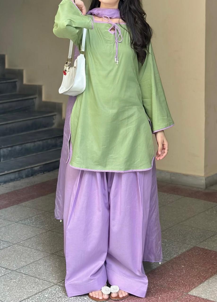 Front view of model wearing the Zarysh Premium Stitched Lawn 3-Piece suit featuring a pistachio green shirt and lavender trousers closeup view.