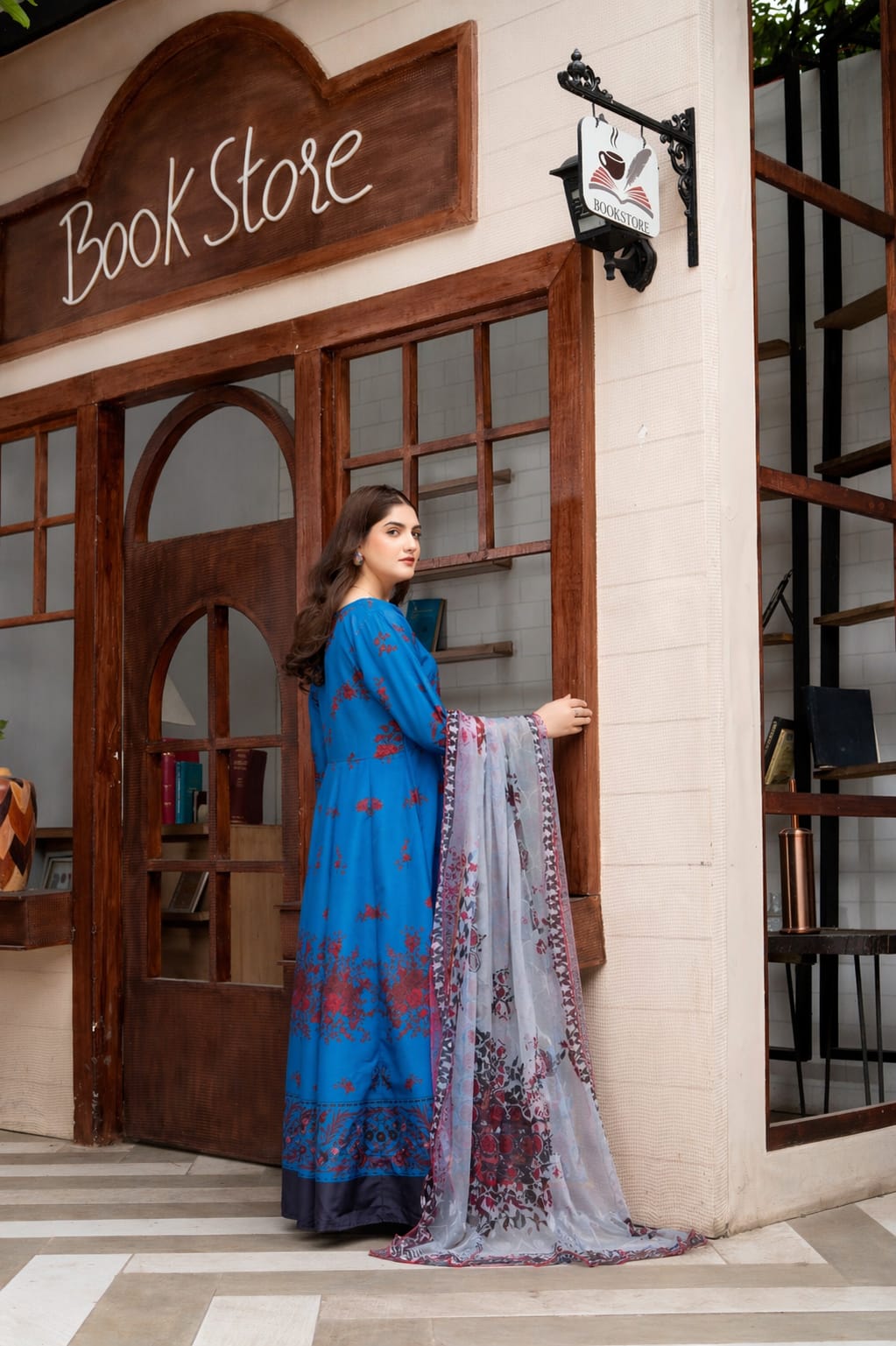 Side view of royal blue printed 2 piece women's suit featuring elegant floral print and digital printed dupatta.